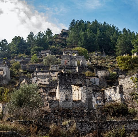 Explore the abandoned ghost town of Kayaköy, just 1km away