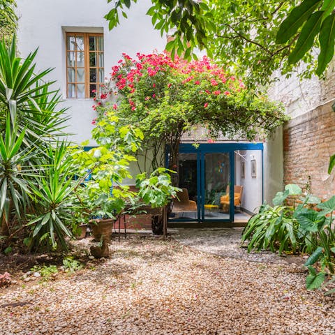 Sip cocktails in the pretty garden after a day of sightseeing