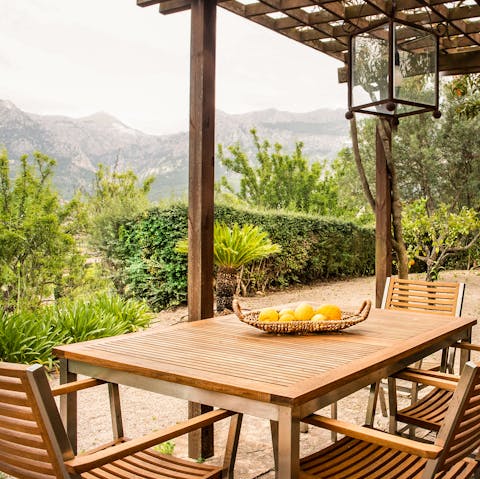 Dine alfresco with views of the Tramuntana Mountains