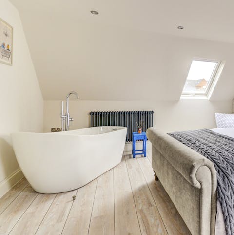 Unwind and relax with a romantic dip in the in-room bathtub