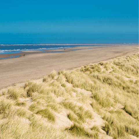 Take the short four-mile drive to the coast for a stroll along the beach