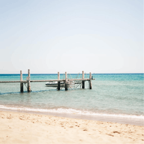 Stroll to Santa Maria del Focallo beach, 50m away