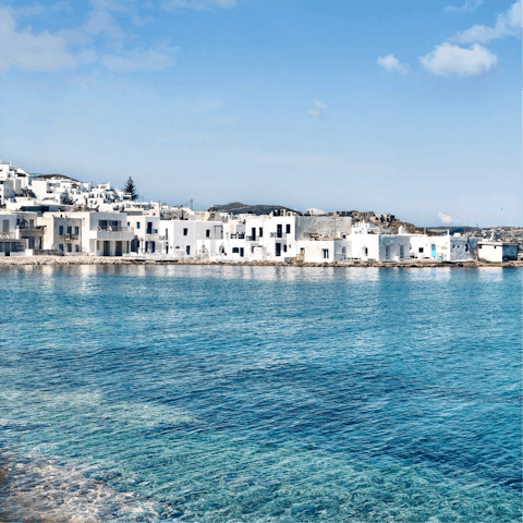 Wander the charming cobbled streets of nearby Naoussa, a twelve-minute drive away