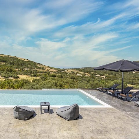Sink into the beanbag chairs beside the pool, taking dips to cool down