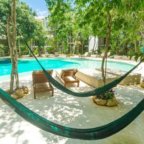 Spend blissful afternoons relaxing by the shared pool