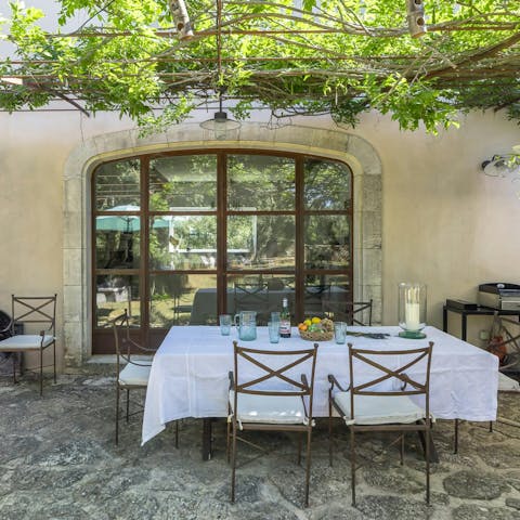 Enjoy a bottle of Provençal rosé on the wisteria-covered terrace
