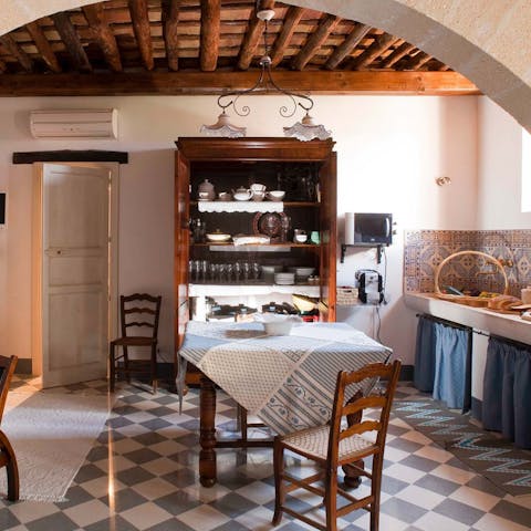 Gather round the country-style dining table for relaxed dinners at home