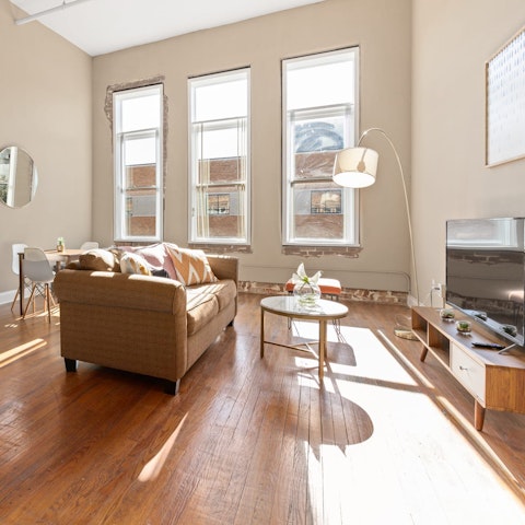 Hang out in the sunshine-filled living room