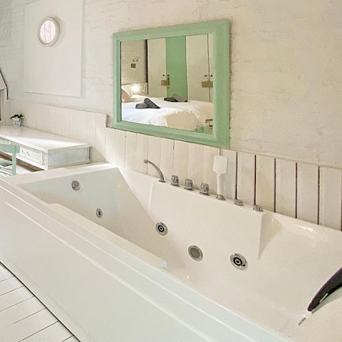 Relax with a long soak in the master bedroom's Jacuzzi bath