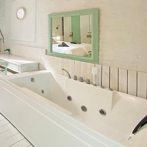 Relax with a long soak in the master bedroom's Jacuzzi bath