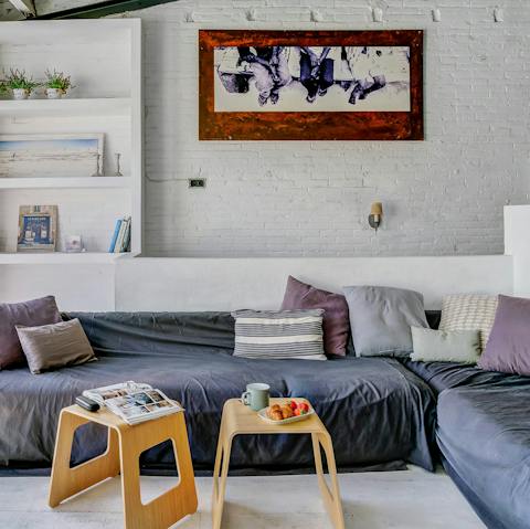 Cosy up on the huge sofas in the bright living room