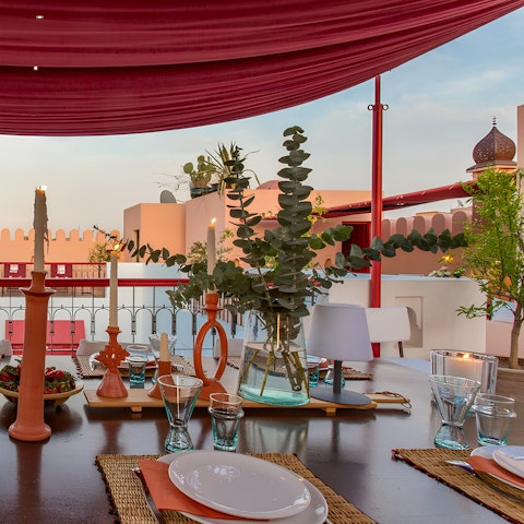Dine alfresco with a view of the rooftops of Marrakech
