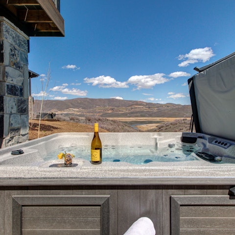 Soak in the hot tub, a glass of fizz at the ready
