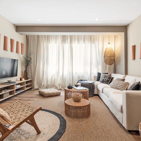 Cosy up on the big, squashy sofa in the bright living room