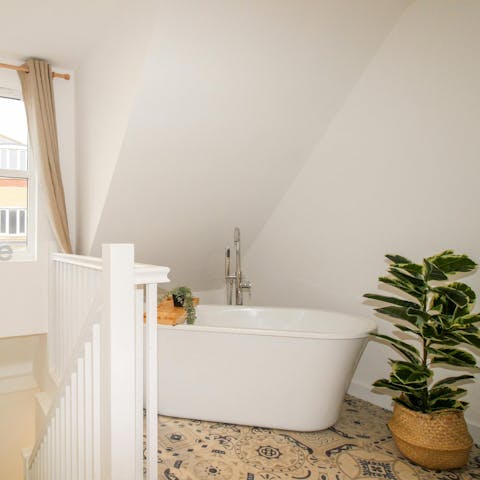 Unwind with a relaxing soak in the freestanding bathtub
