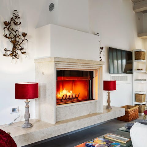 Sip cocktails in front of the fireplace