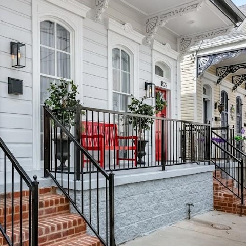 Enjoy your morning coffee on the Southern-style porch, taking in the sounds of the city
