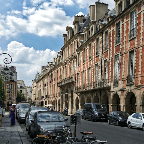 Pick up some pastries to enjoy in the historic Place des Voges, a sixteen-minute walk away