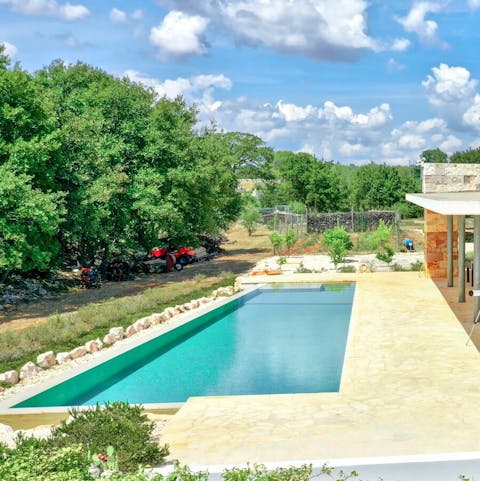 Take a dip in the glittering aquamarine pool, cooling off from the Southern Italy sun
