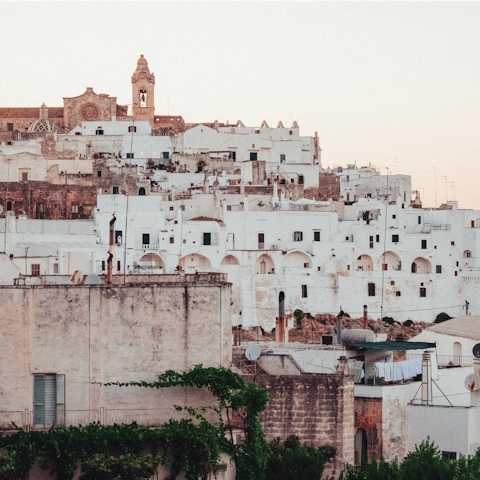 Spend the evening wandering the enchanting streets of Ostuni – a twenty-five minute drive away