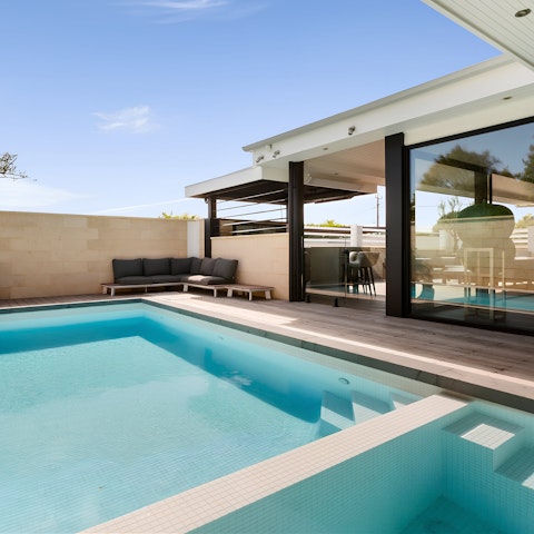 Savour slow days lounging by the heated pool