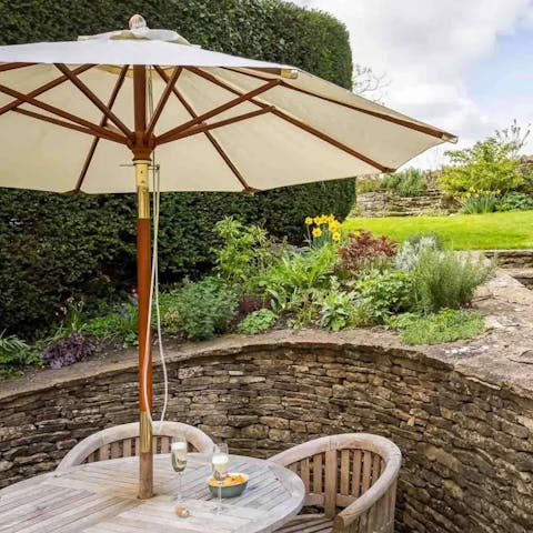 End the evening with sundowners in the tiered cottage garden
