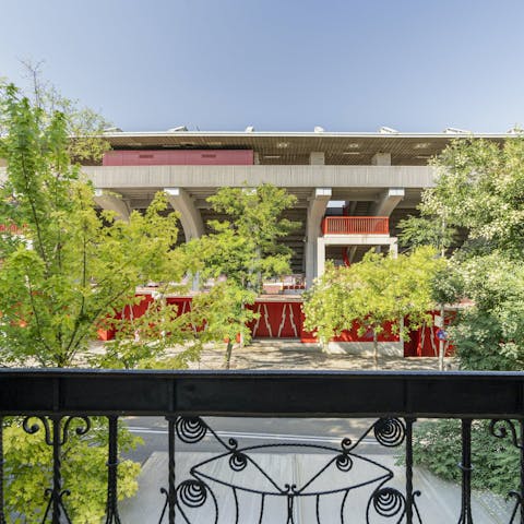 Pour a glass of wine and take a breath on the small balcony