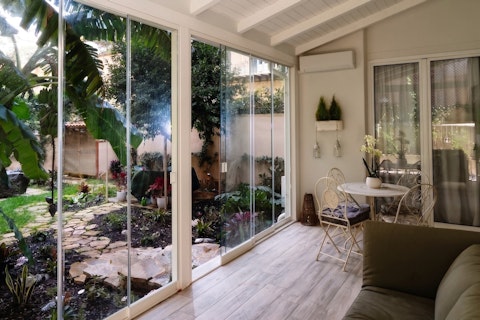 Discover the garden room where exotic foliage envelops you year-round