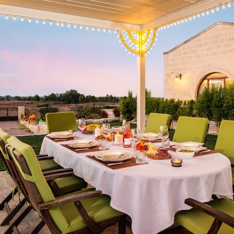 Gather everyone beneath the pergola for an alfresco evening feast
