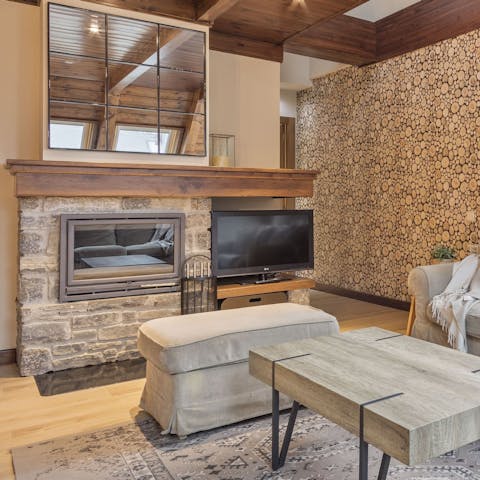 Get a fire going in the stone fireplace after a day in the snow
