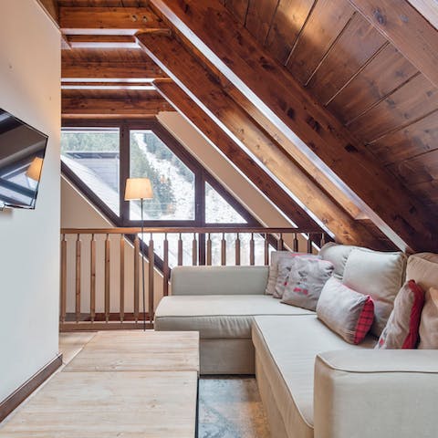 Hide away in the second snug living area and watch the snow fall outside
