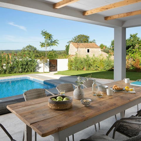Enjoy an alfresco meal at the spacious outdoor table