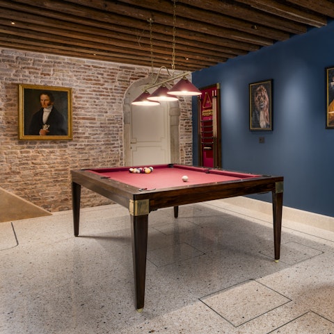 Play a round of billiards in the entrance hall