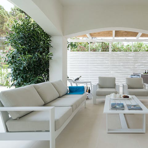 Enjoy a glass of wine or two on the covered terrace at sundown