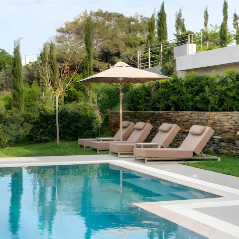 Lounge on the lawn beside the private pool