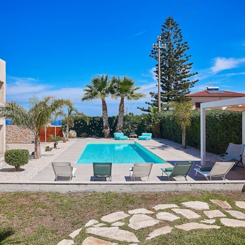 Relax in the Sicilian sun next to the private pool