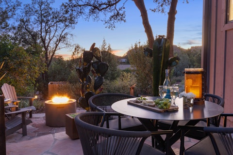 Gather around the fire pit as Sedona's hills fade to dark
