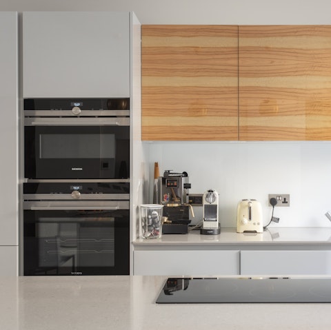 Fix meals in the lovely modern kitchen to enjoy all together at the dining table