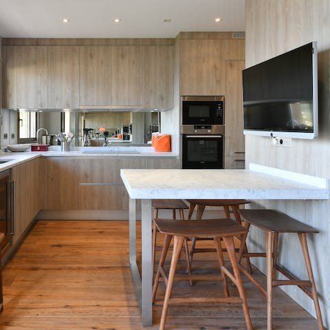 Prepare some tasty gougères for lunch in the sleek kitchen