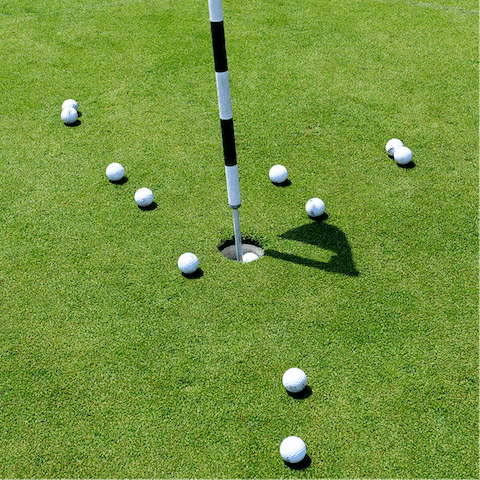 Play a round at the eighteen-hole golf course