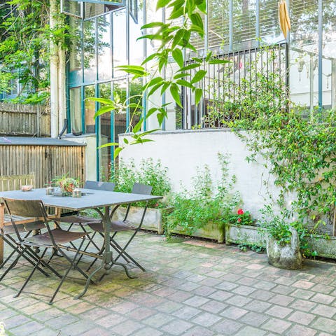 Dine alfresco on some local French cuisine in the tranquil private garden space