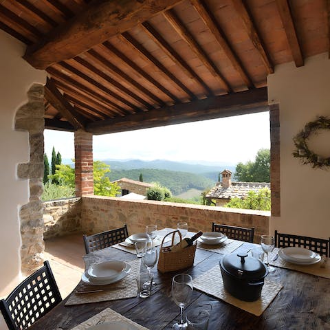 Gaze out at views of the rolling countryside from the covered terrace