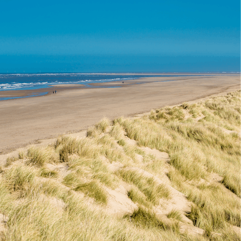 Spend your days on Brancaster beach, a fifteen-minute drive away