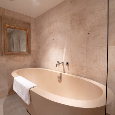 Treat your tired limbs to a luxurious soak in the freestanding tub