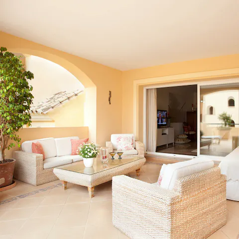 Share a bottle of Rioja on the shaded veranda