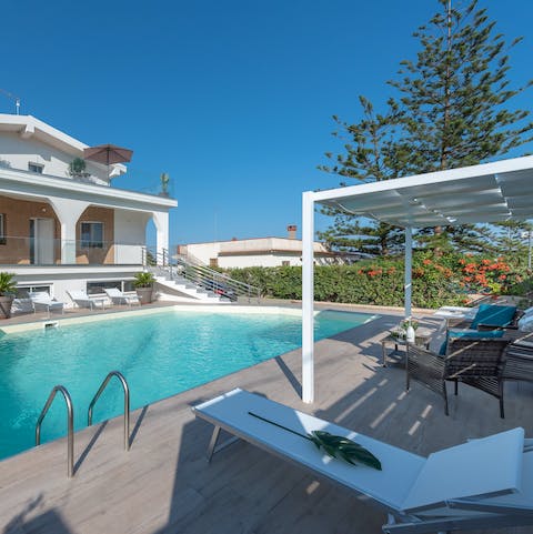 Lounge by the water or see shade under the pergola