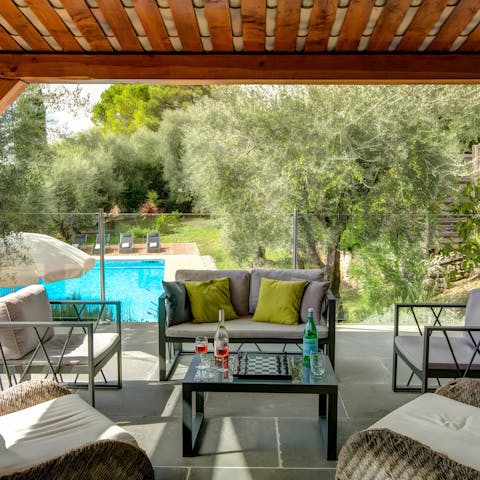 Grab the wine and sit down in the shade on the covered terrace