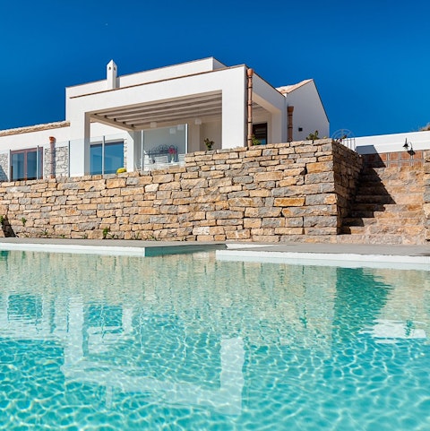 Take a refreshing dip in the glittering swimming pool on hot days