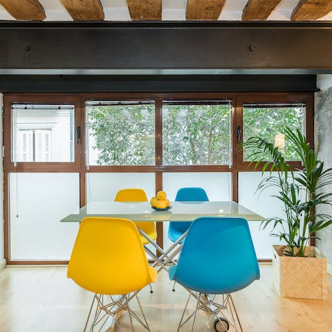 Gather together for an at-home tapas feast around the window-facing dining table