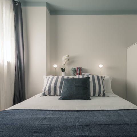 Get some rest in the comfy bedroom after a busy day in Milan